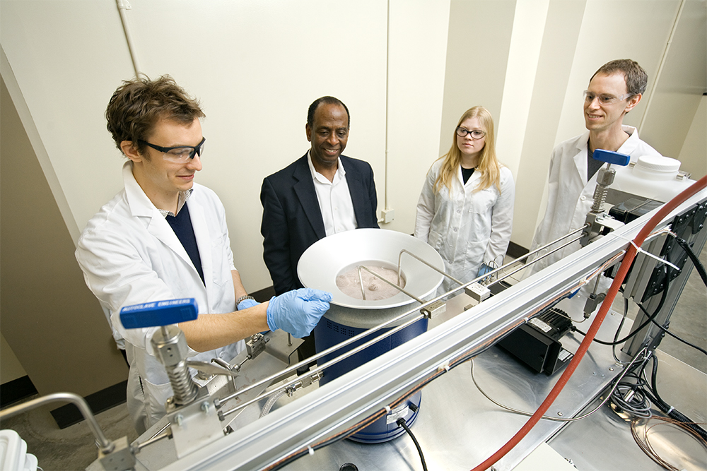 Larry Walker, Ph.D., with researchers in the Biofuels Research Laboratory at Cornell University.