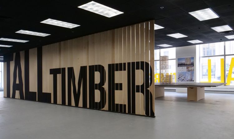 An open room with wood panels from floor to ceiling displaying 