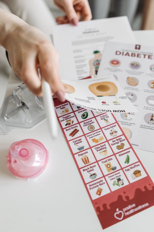 A photo of documents and pamphlets about diabetes being shared to a patient.