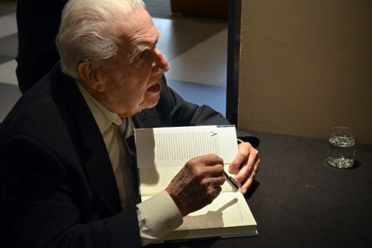 Dr. Howard Tanner signs his book 
