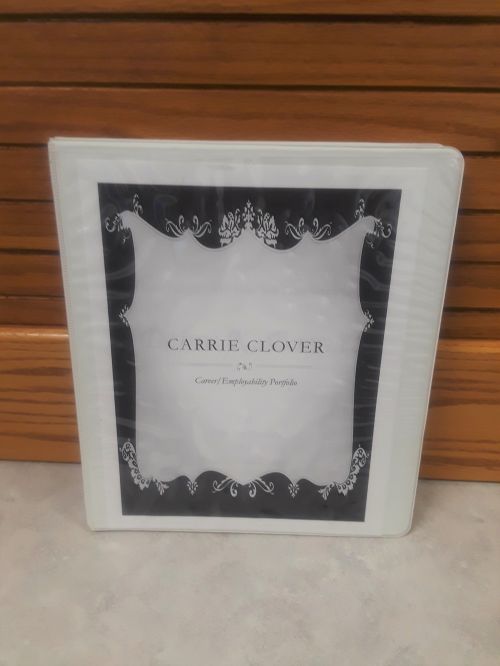 A photo of a three-ring binder portfolio.