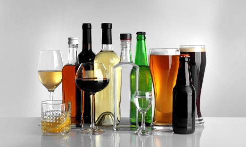 Photo of generic non-labeled wine, beer, and alcohol bottles and glasses.