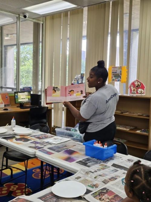 Shameca Dillon, AmeriCorps member at Oakland County MSU Extension reading The Grouchies part of Mindful Me curriculum