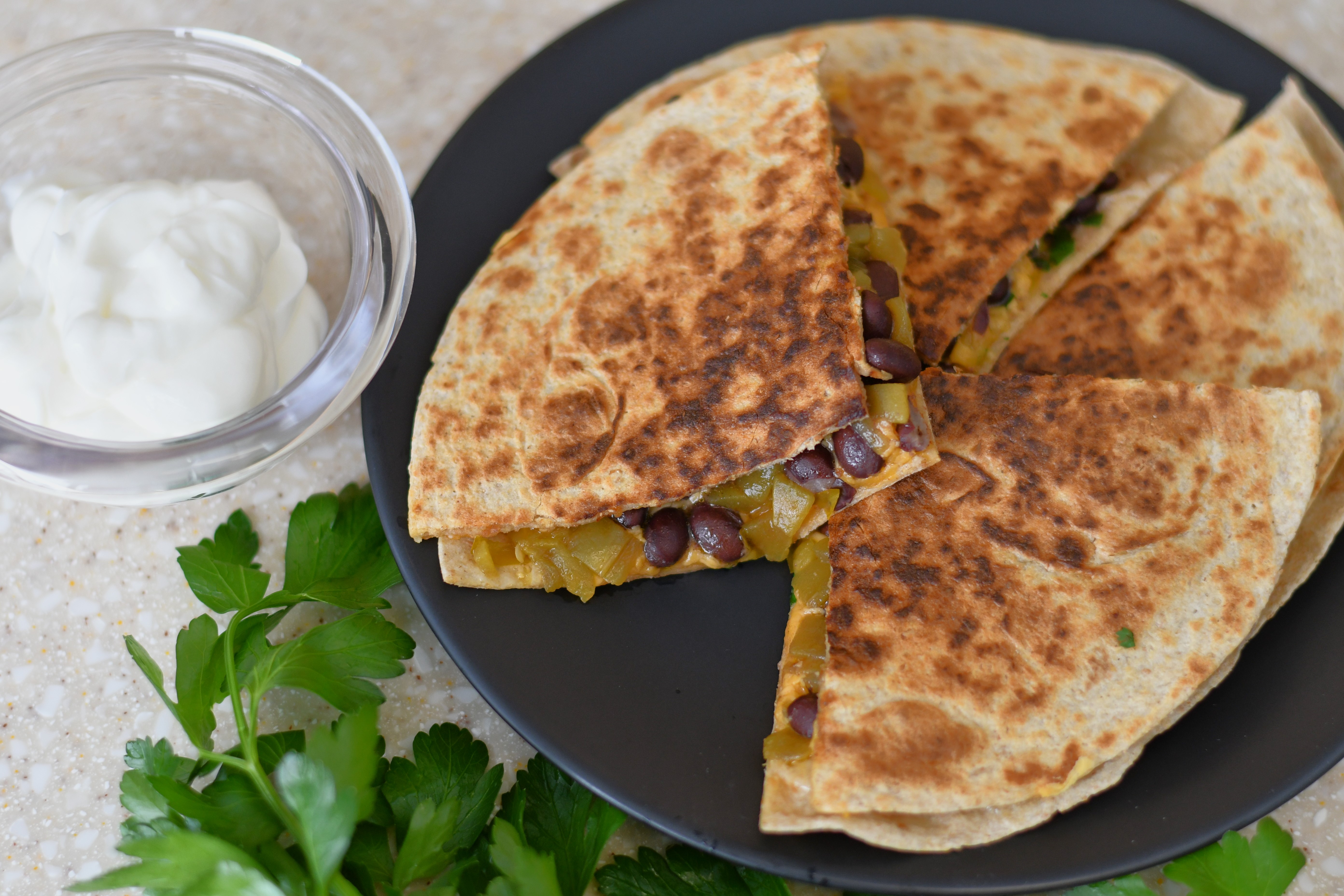 A photo of a quesadilla on a plate