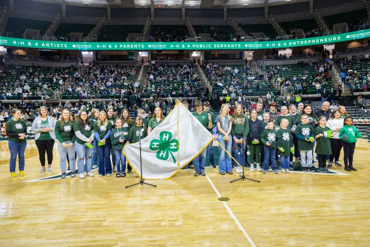 A group of youth on the court at halftime.