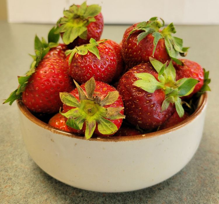 A bowl of strawberries.