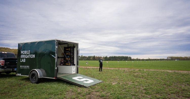open cargo trailer on a green field
