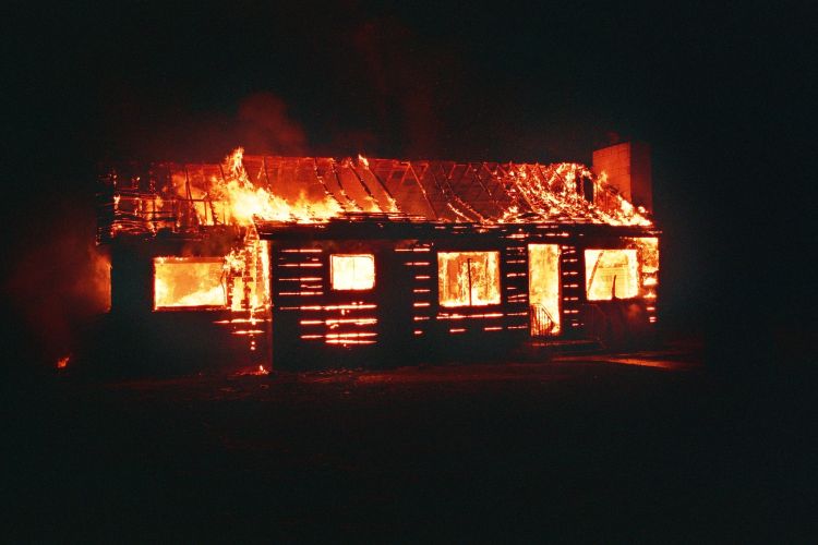 A structure engulfed in flames.