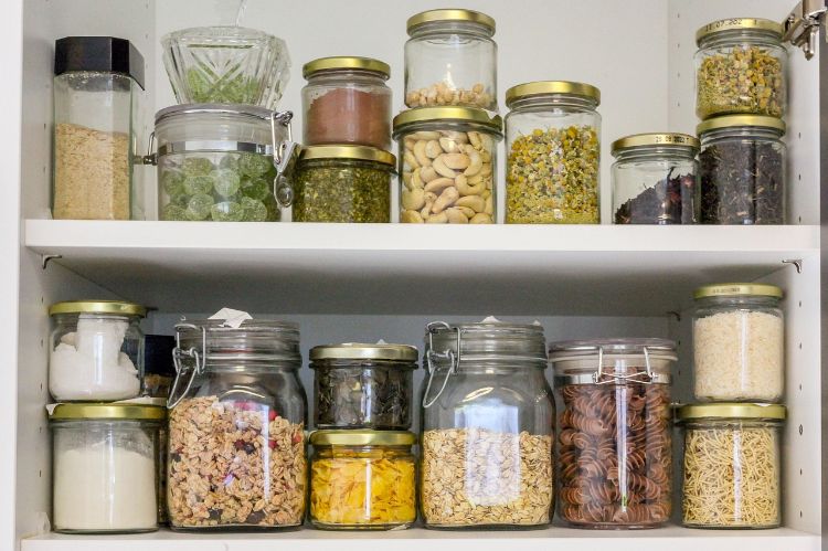 Various jars in a pantry.