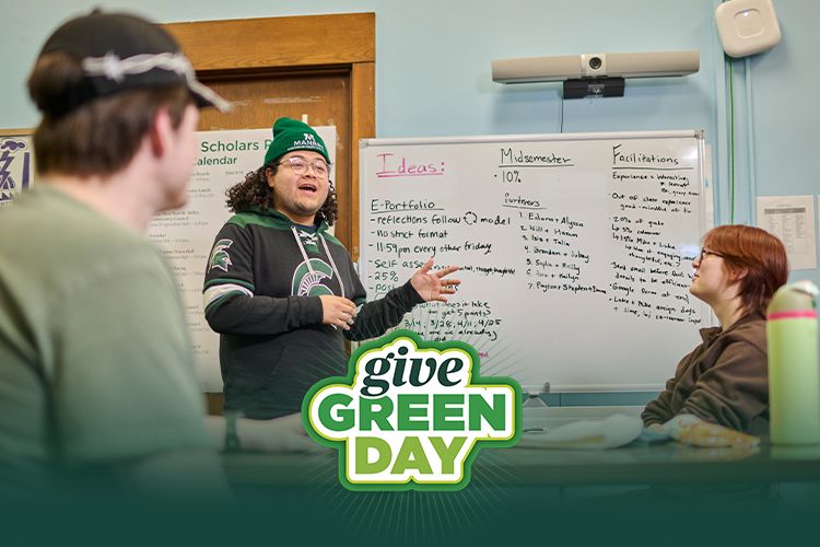 Image of CANR students working on a class project, image also include the Give Green Day logo.