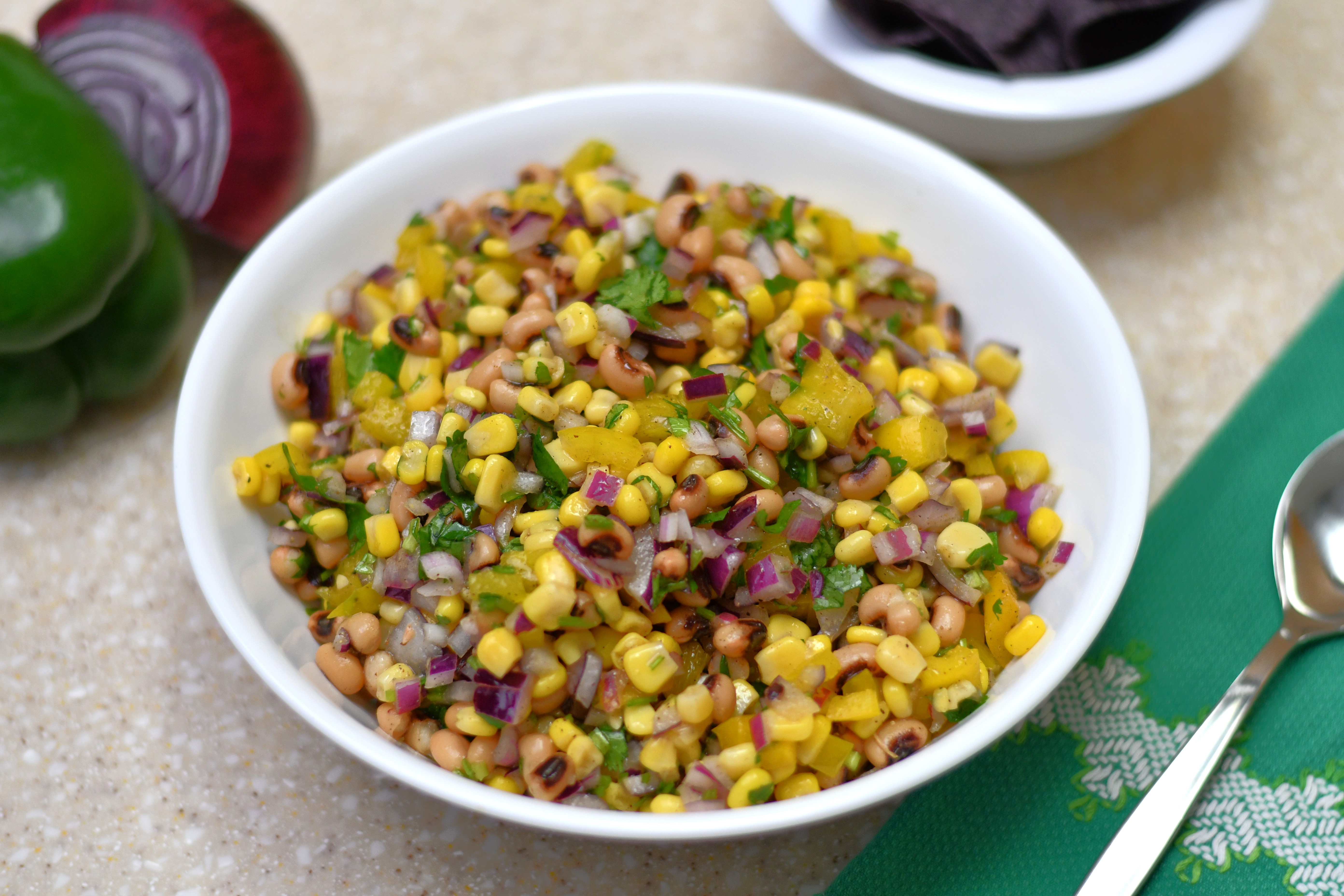 A photo of a bowl of corn and black-eyed peas salad