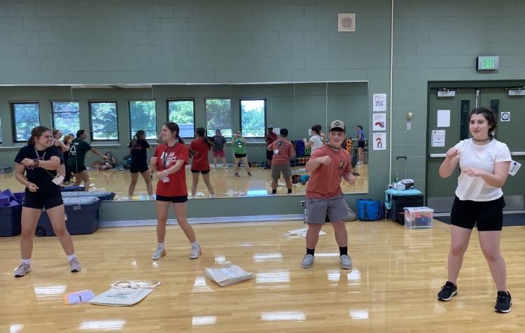 Four young adults participating in a fitness and career preparation event. For decorative purposes.