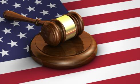 A gavel resting on the American flag.