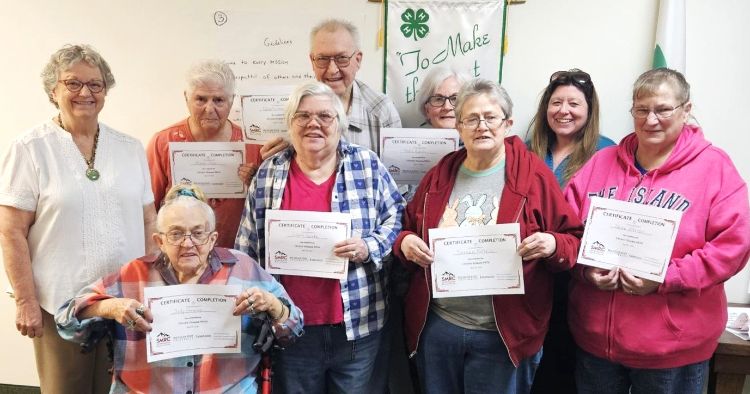 The diabetes class instructors and group posing with their certificates.