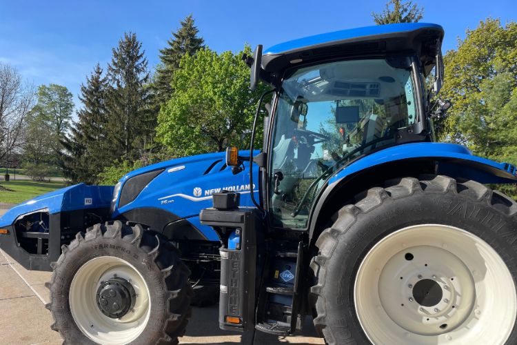 Image of the New Holland T6.180 Methane tractor on the MSU campus.