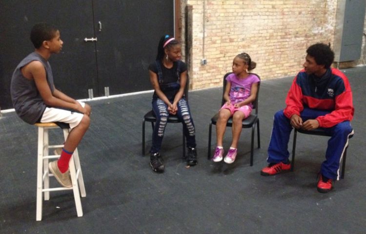 Youth learning with an adult mentor.