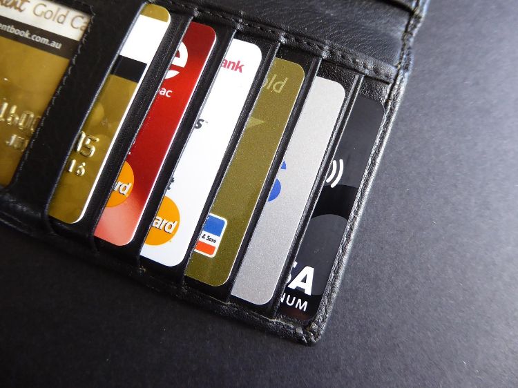 Several credit cards inside a wallet.
