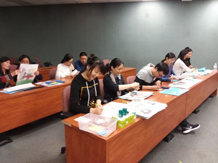 China Art Selection Process Visiting International Professional Program (VIPP) volunteers translating the artwork chosen from English to Chinese