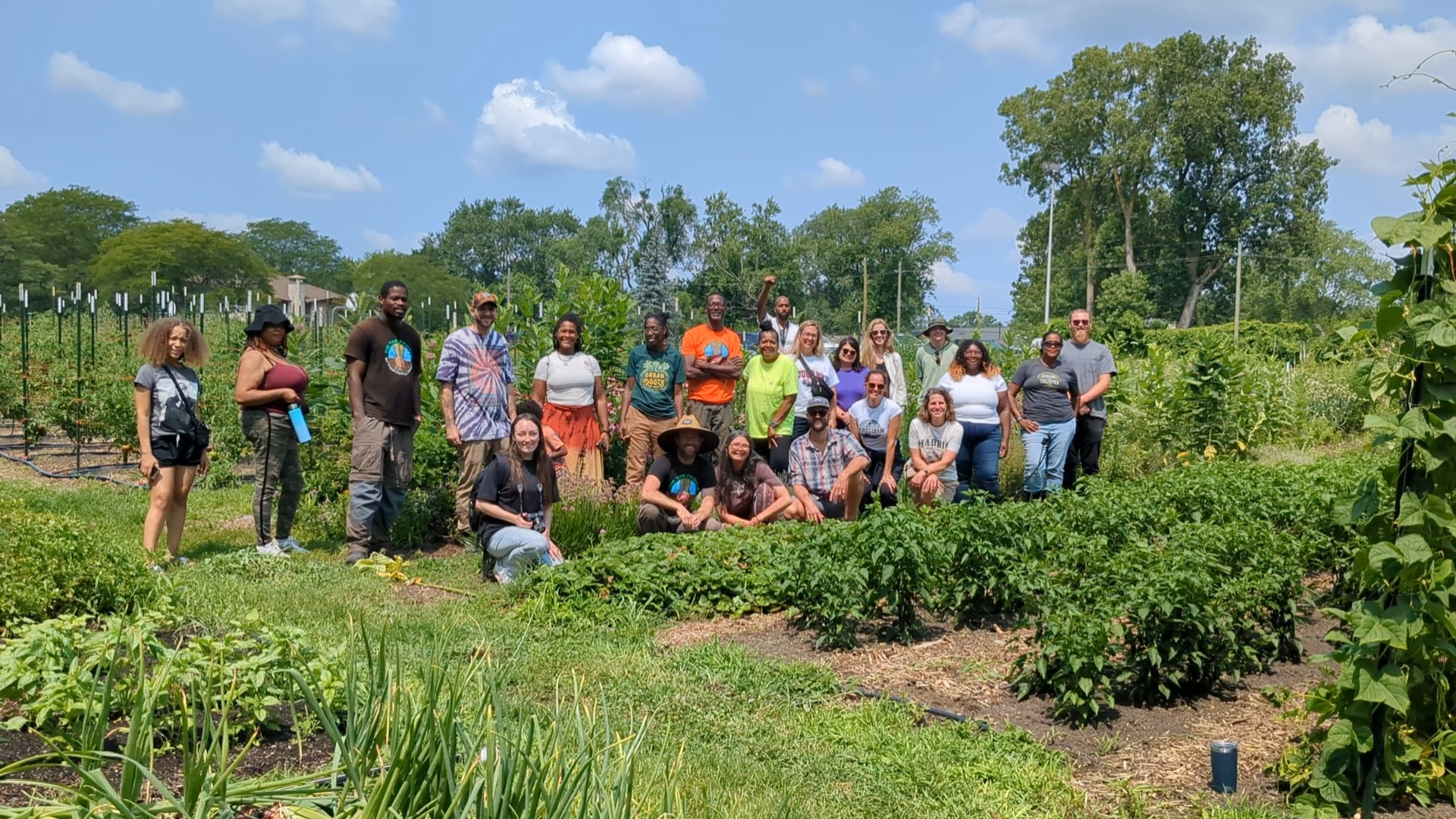 20 peole standing for a photo at We the People Opportunity Farm in Ypsilanti.