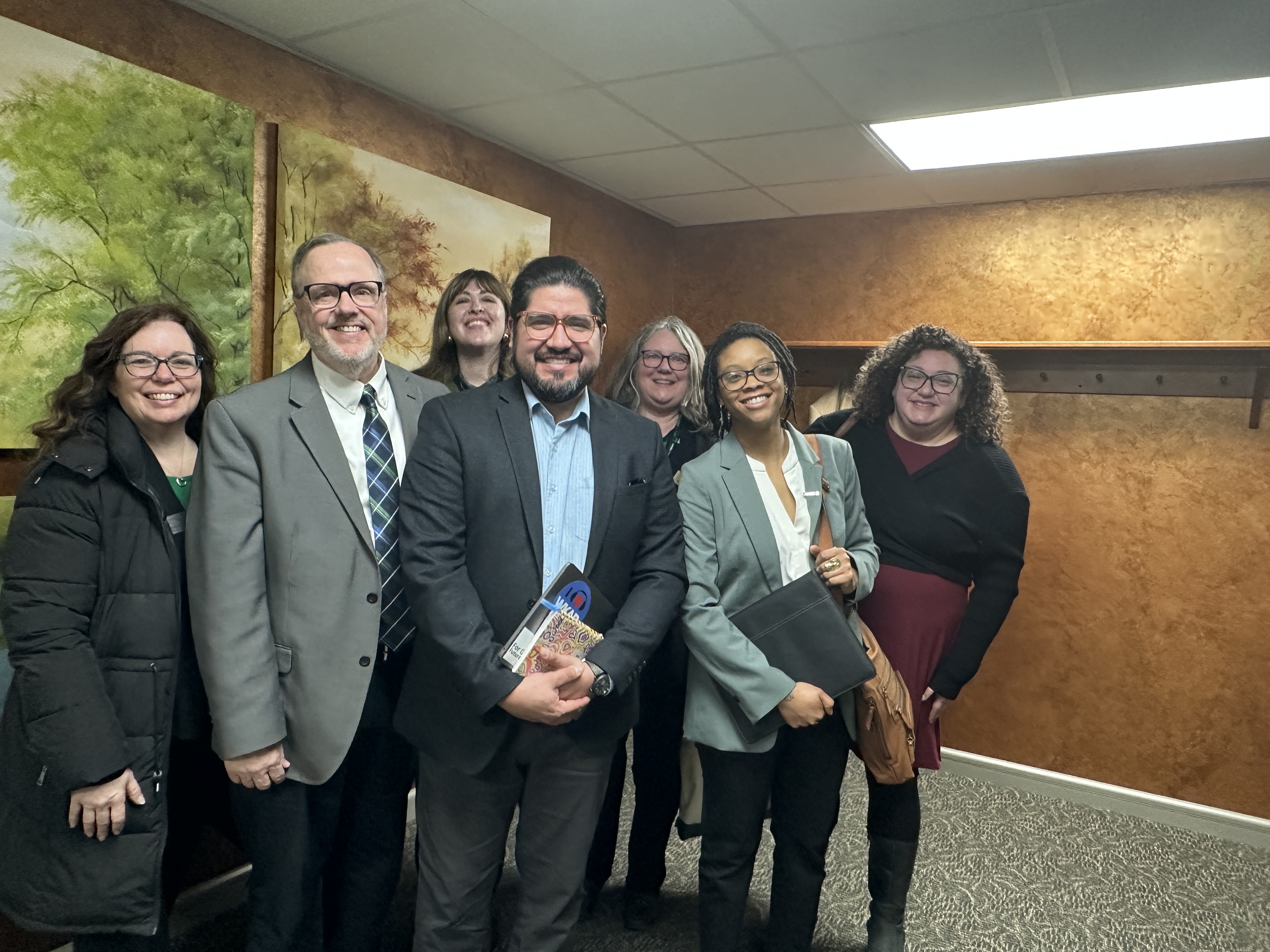 A group of people smile