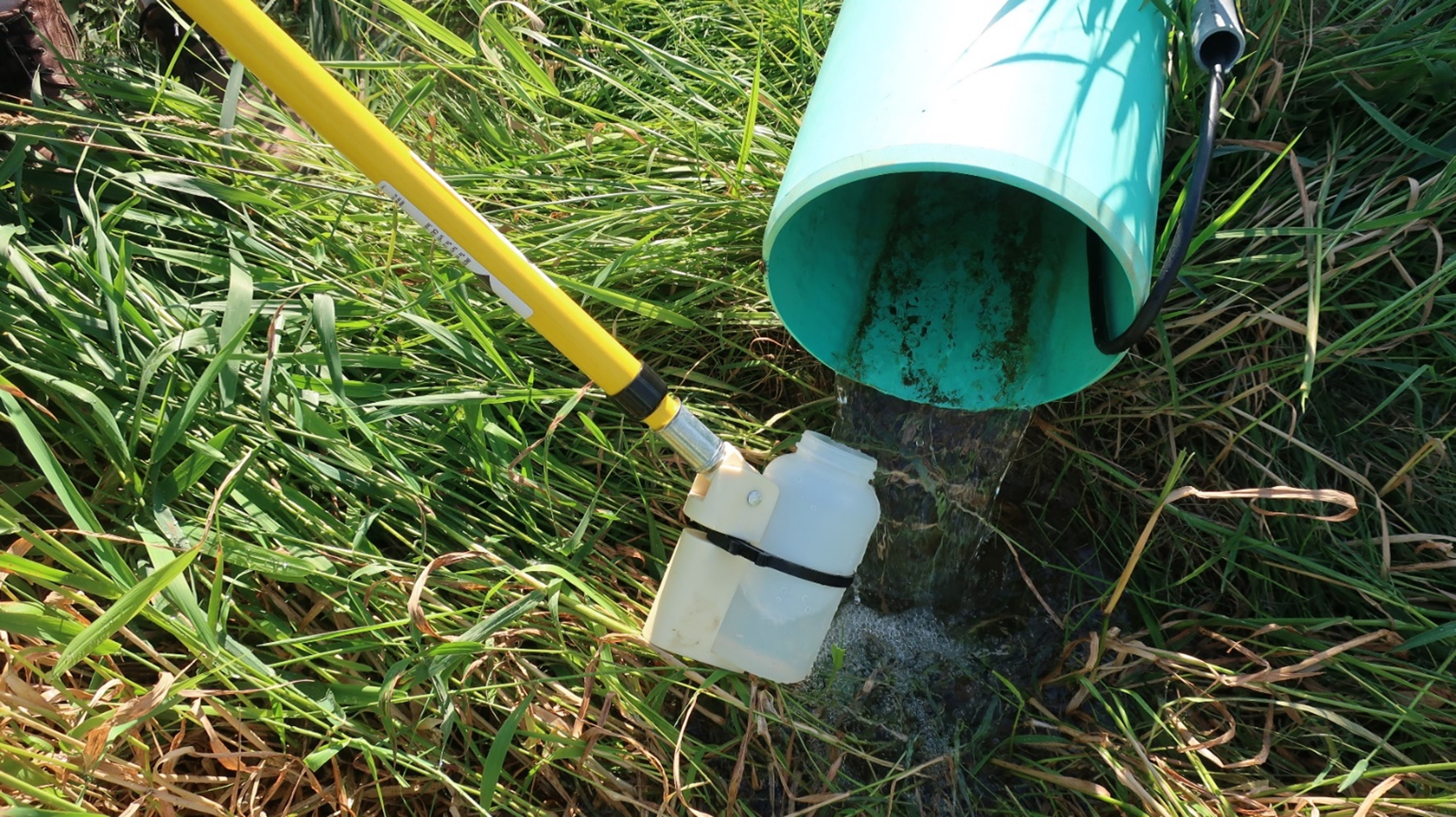 Figure 4- Grab sampling from the subsurface drainage discharge.