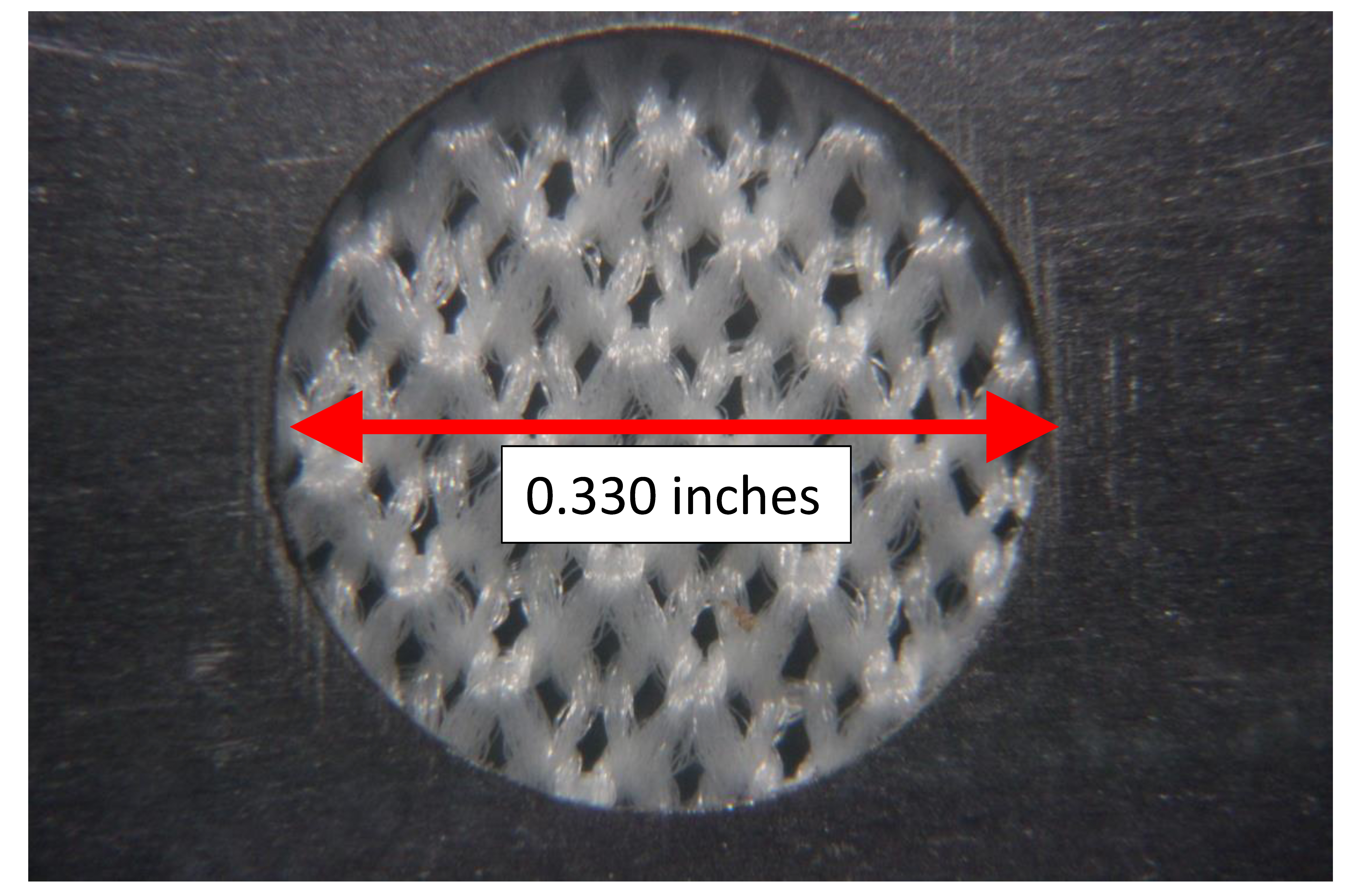 Figure 7- A microscope image of a knitted-sock envelope that keeps fine sand and silt out of the pipe, and allows clay particles to pass through.