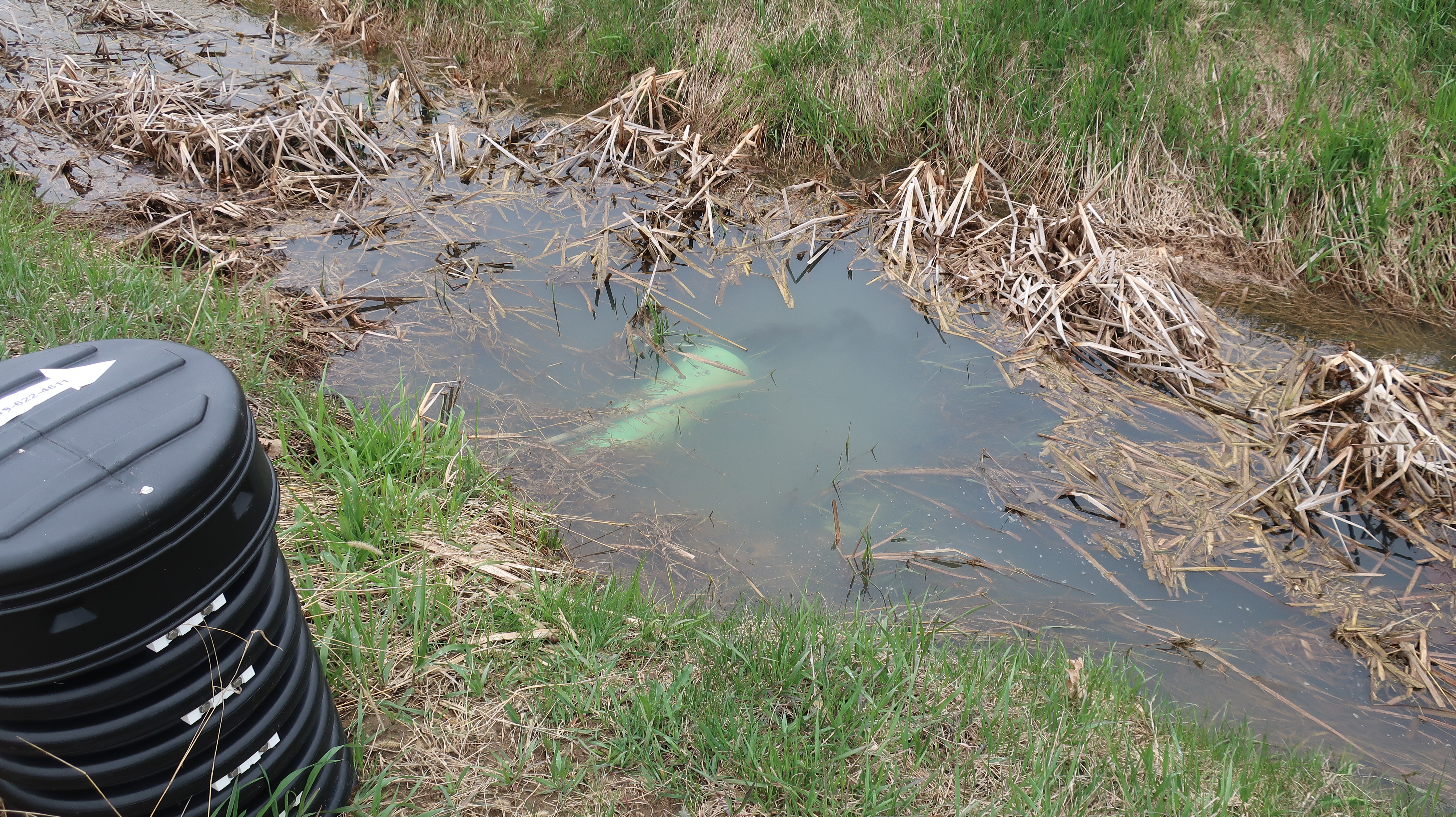 The outlet is submerged because it is too close to the ditch bottom