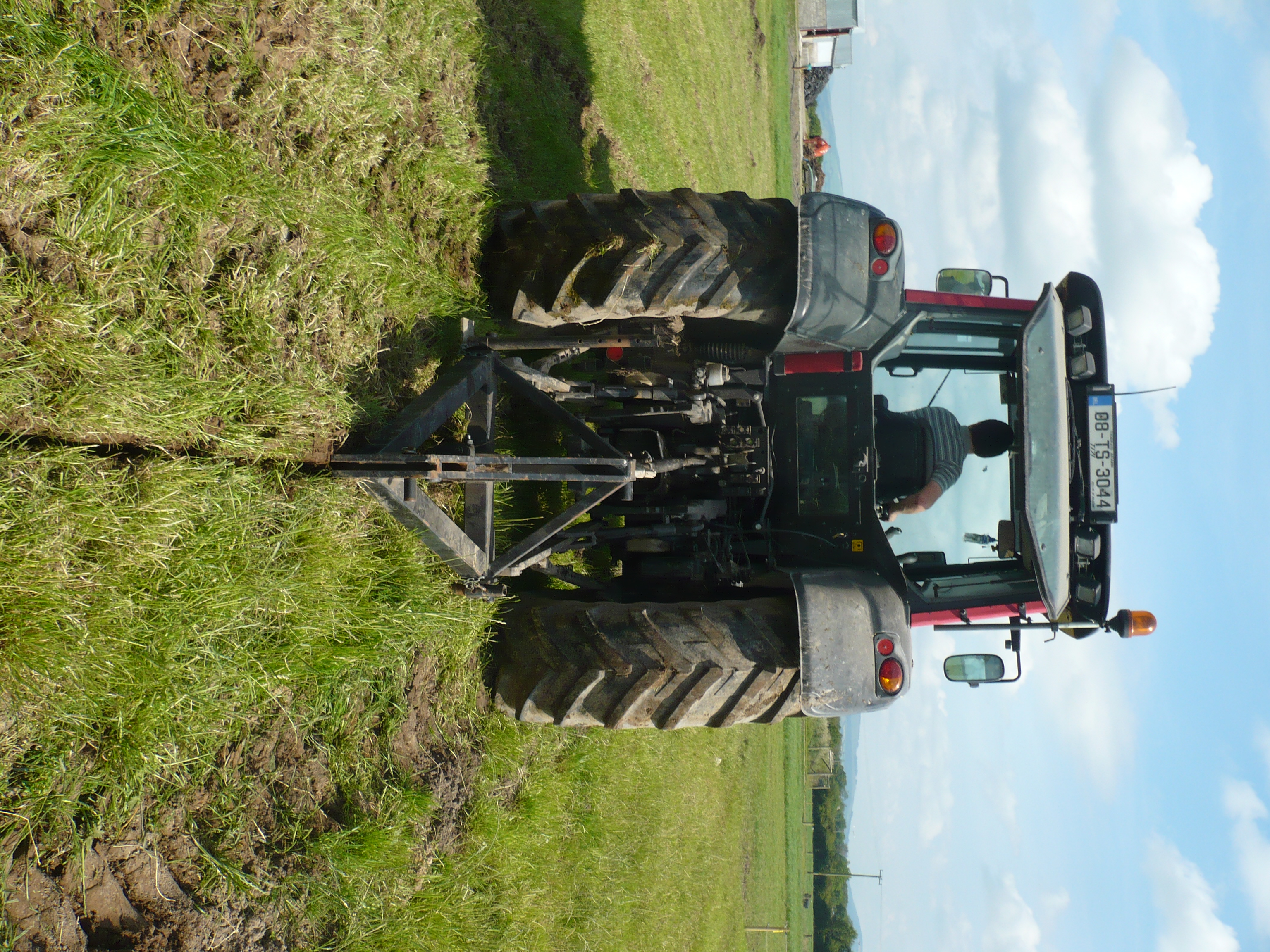 A tractor pulling a mole plow. The shank (leg) creates a blade-cut to break up the clay-pan or compacted layer to improve infiltration (Photo credit: Patrick Tuohy).